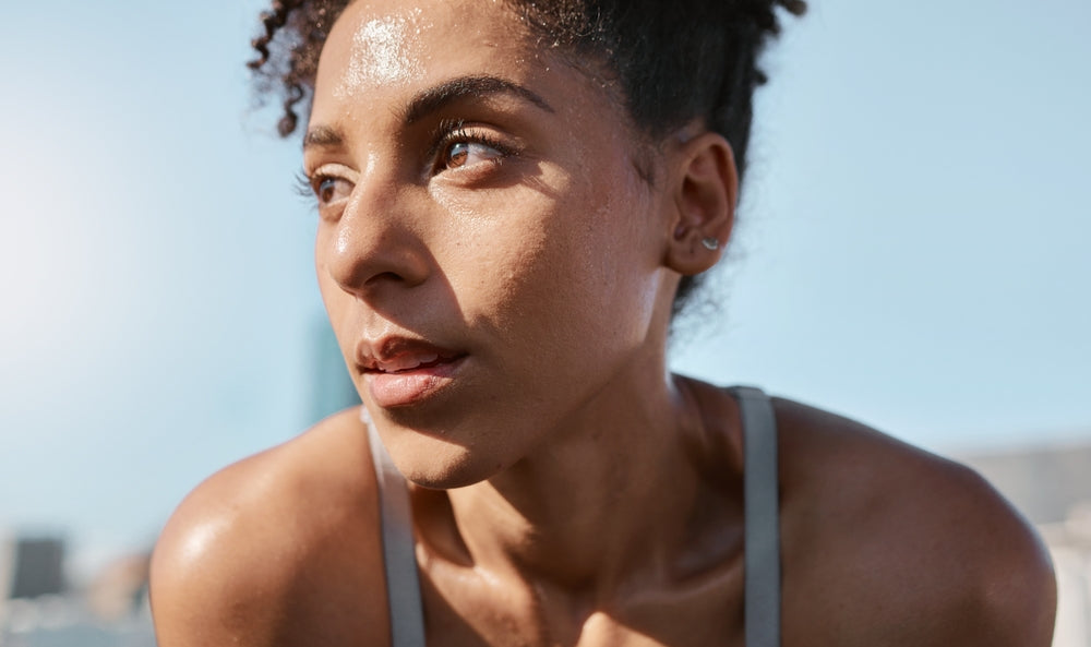 Close up of woman sweating on her face